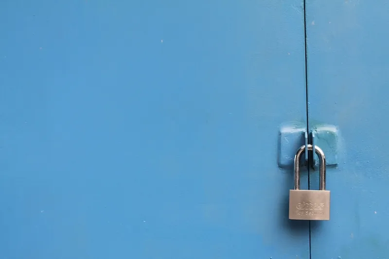 A padlock on a door.